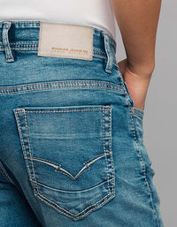 Medium Blue 5 Pocket Low-Rise Tapered Ankle Length Stretch Jeans