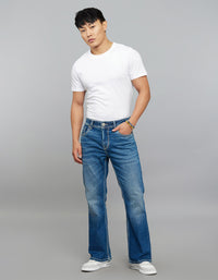 Med Blue 5 Pocket Mid Rise Cropped Length Loose Boot Leg Stretch Jeans