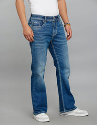 Med Blue 5 Pocket Mid Rise Cropped Length Loose Boot Leg Stretch Jeans