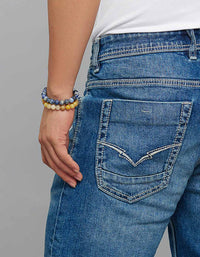 Med Blue 5 Pocket Mid Rise Cropped Length Loose Boot Leg Stretch Jeans