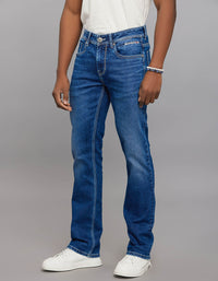Medium Blue 5 Pocket Mid Rise Loose Boot Leg Stretch Jeans