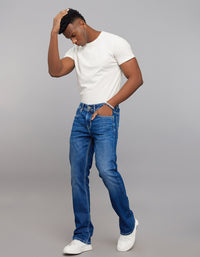 Medium Blue 5 Pocket Mid Rise Loose Boot Leg Stretch Jeans