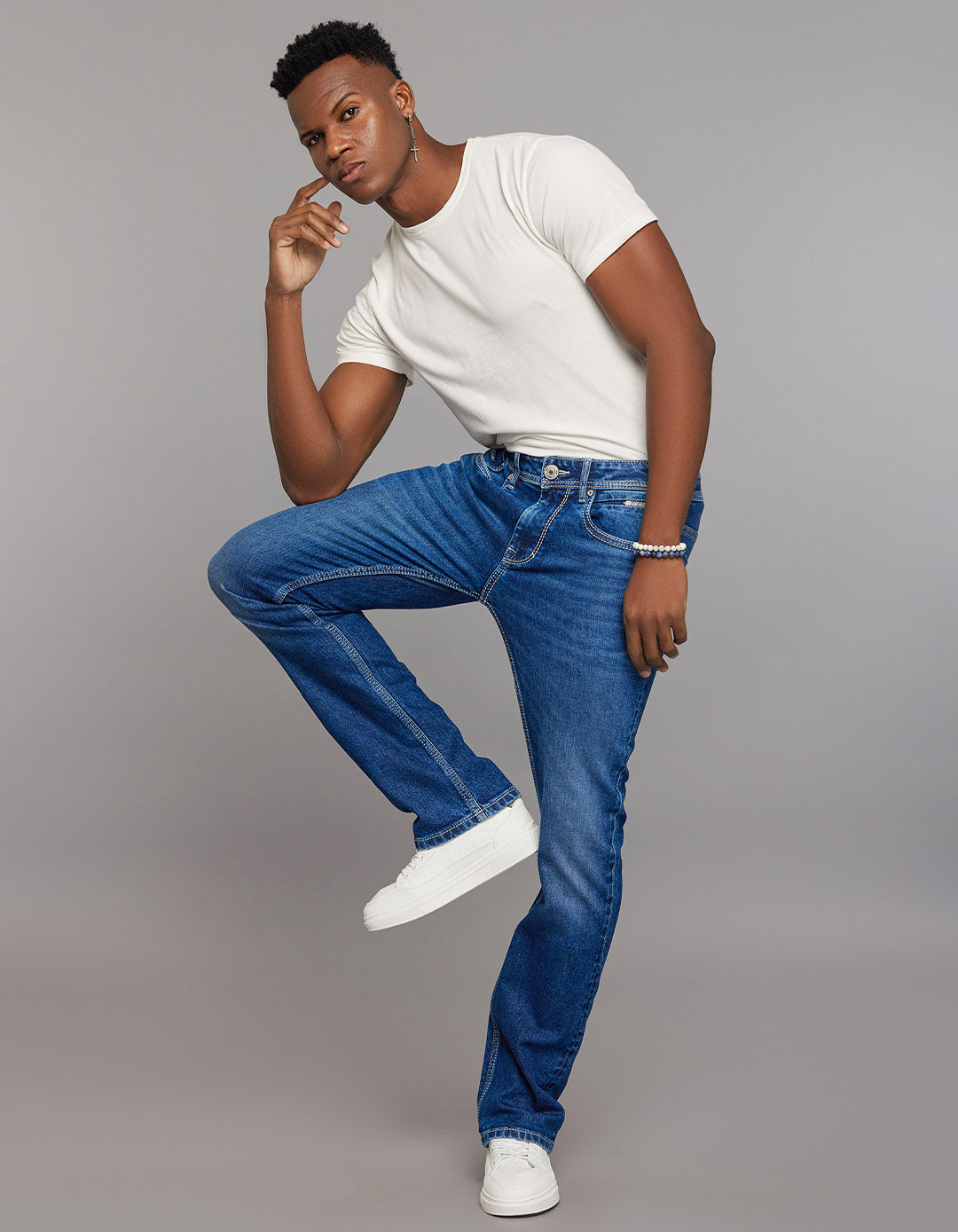 Medium Blue 5 Pocket Mid Rise Loose Boot Leg Stretch Jeans