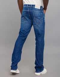 Medium Blue 5 Pocket Mid Rise Loose Boot Leg Stretch Jeans