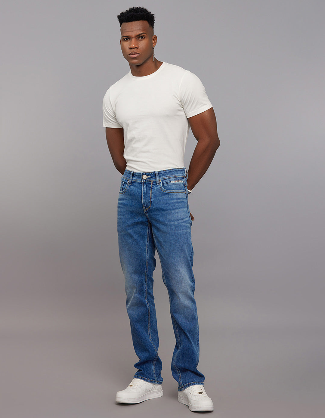 Medium Blue 5 Pocket Mid Rise Loose Boot Leg Stretch Jeans