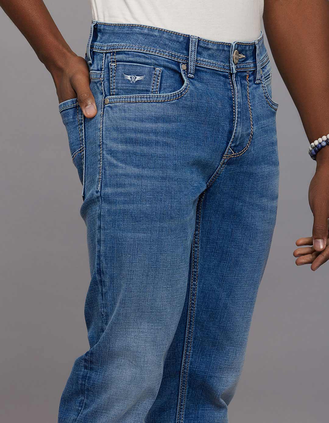Medium Blue 5 Pocket Mid Rise Loose Boot Leg Stretch Jeans