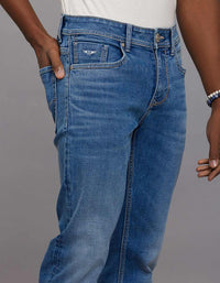 Medium Blue 5 Pocket Mid Rise Loose Boot Leg Stretch Jeans