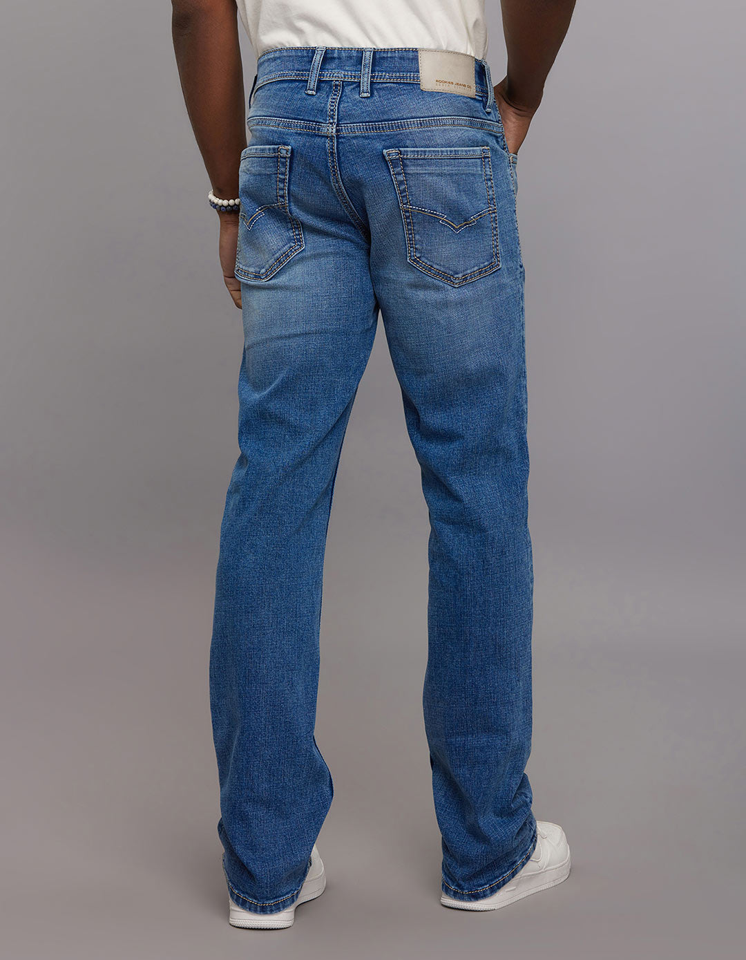 Medium Blue 5 Pocket Mid Rise Loose Boot Leg Stretch Jeans