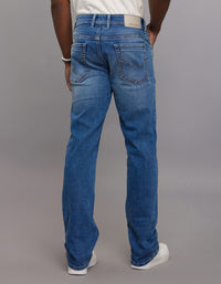 Medium Blue 5 Pocket Mid Rise Loose Boot Leg Stretch Jeans