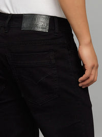 Black 5 Pocket Mid Rise Cropped Length Loose Boot Leg Stretch Jeans