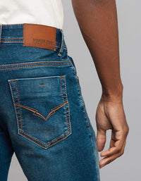 Dark Blue 5 Pocket Mid Rise Loose Boot Leg Stretch Jeans