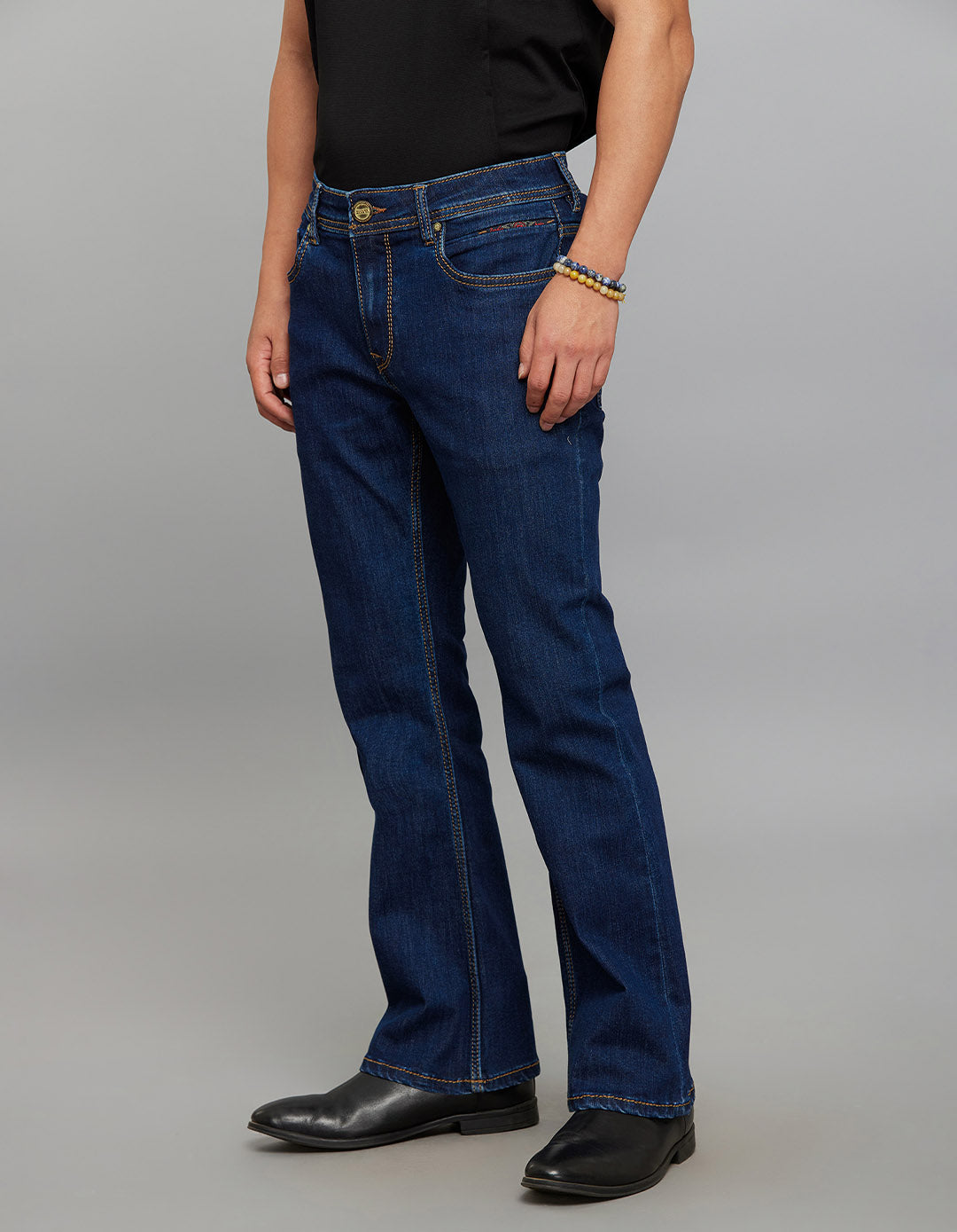 Dark Blue 5 Pocket Mid Rise Cropped length Loose Boot Leg Stretch Jeans