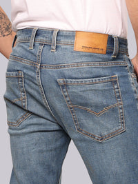 Med Blue Mid Rise Loose Boot Leg Stretch Jeans