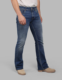 MED BLUE 5 Pocket Mid Rise Cropped length Loose Boot Leg Stretch Jeans