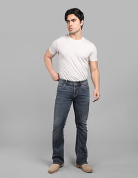 Med Blue 5 Pocket Mid Rise Loose Boot Leg Stretch Jeans