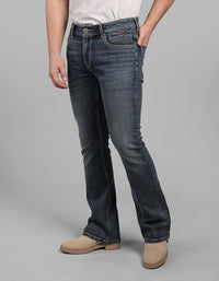 Med Blue 5 Pocket Mid Rise Loose Boot Leg Stretch Jeans