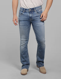 Med Blue Mid Rise Cropped Length Loose Boot Leg Stretch Jeans