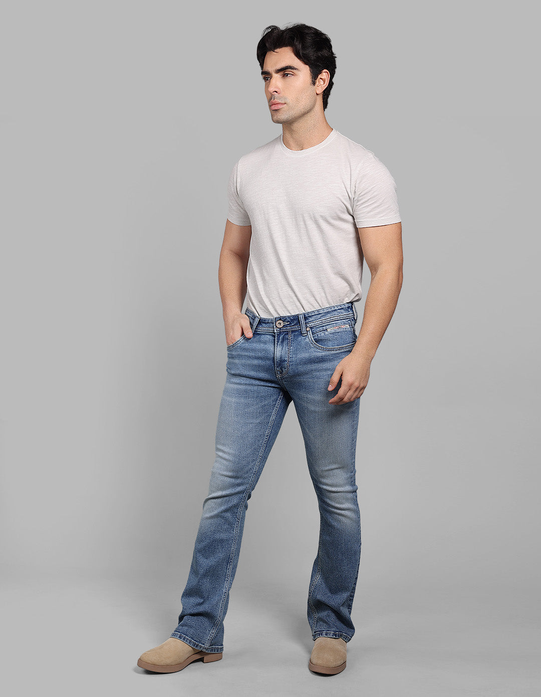 Med Blue Mid Rise Cropped Length Loose Boot Leg Stretch Jeans