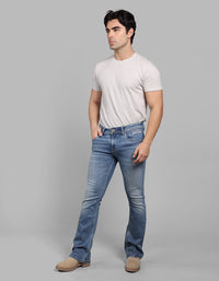 Med Blue Mid Rise Cropped Length Loose Boot Leg Stretch Jeans