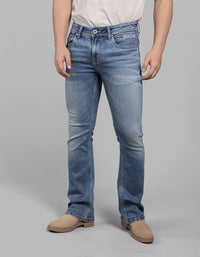 Med Blue Mid Rise Cropped Length Loose Boot Leg Stretch Jeans