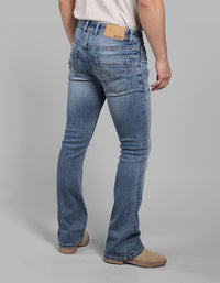 Med Blue 5 Pocket Mid Rise Loose Boot Leg Stretch Jeans