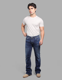 Med Blue Mid Rise Cropped Length Loose Boot Leg Stretch Jeans