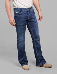 Med Blue 5 Pocket Mid Rise Loose Boot Leg Stretch Jeans