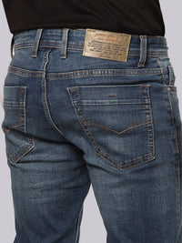 Med Blue Mid Rise Loose Boot Leg Stretch Jeans
