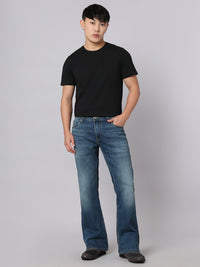 Med Blue Mid Rise Cropped Length Loose Boot Leg Stretch Jeans