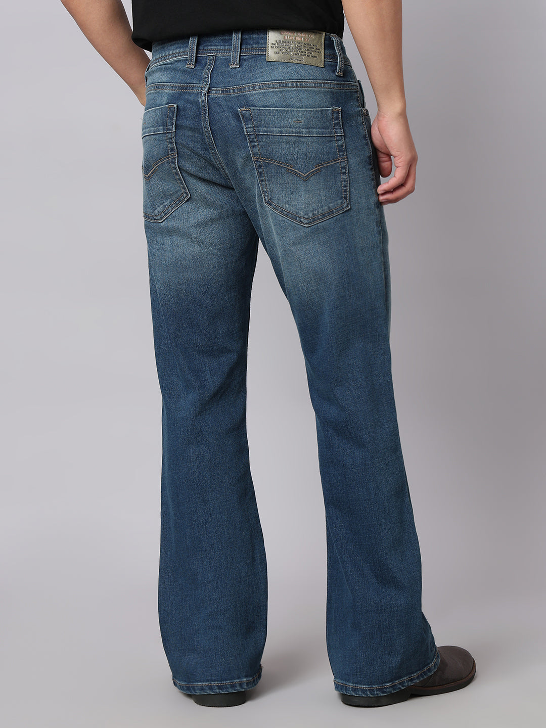 Med Blue Mid Rise Cropped Length Loose Boot Leg Stretch Jeans