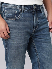 Med Blue Mid Rise Cropped Length Loose Boot Leg Stretch Jeans