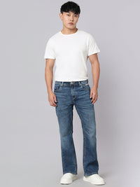 Med Blue Mid Rise Cropped Length Loose Boot Leg Stretch Jeans