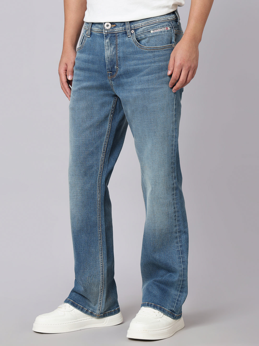 Med Blue Mid Rise Cropped Length Loose Boot Leg Stretch Jeans