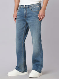 Med Blue Mid Rise Cropped Length Loose Boot Leg Stretch Jeans
